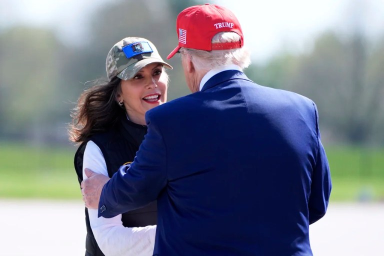 President Donald Trump greets Michigan Gov. Gretchen Whitmer (D) as he arrives on Air Force One at Selfridge Air National Guard Base, Tuesday, April 29, 2025, in Harrison Township, Michigan.