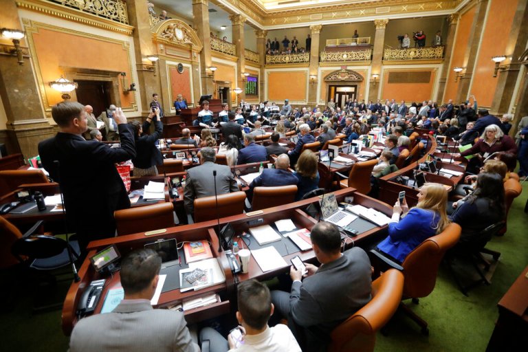 Lawmakers conduct business on the floor of the Utah House.