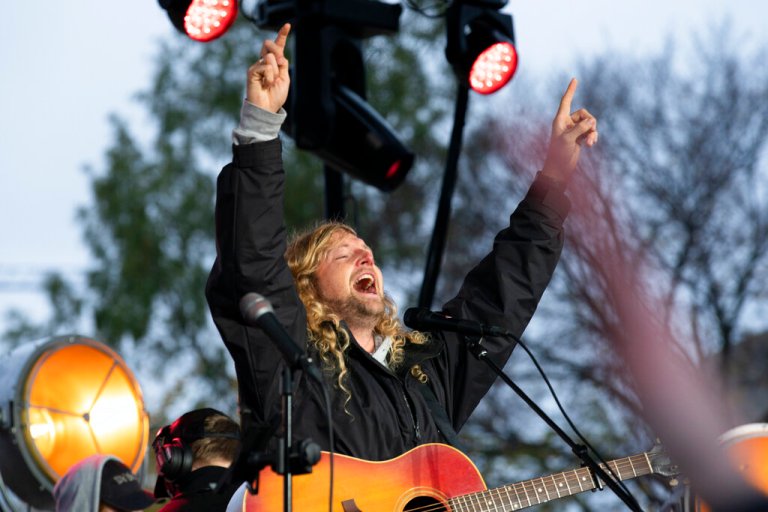 Christian musician Sean Feucht, of California, sings to the crowd during a rally at the National Mall in Washington.