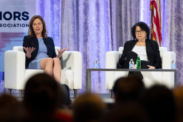 Supreme Court Justices Amy Coney Barrett, left, and Sonia Sotomayor speak with retired U.S. Appeals Court Judge Thomas Griffith, not shown, during a panel discussion at the winter meeting of the National Governors Association, Feb. 23, 2024 in Washington. In joint appearances less than three weeks apart, ideologically opposite Justices Amy Coney Barrett and Sonia Sotomayor said a Supreme Court where voices don’t get raised in anger can be a model for the rest of the country in these polarized times. (AP Photo/Mark Schiefelbein, File)