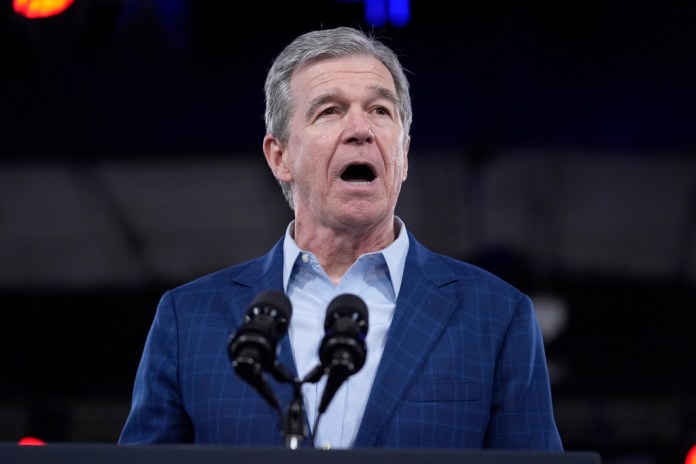 North Carolina Gov. Roy Cooper speaks at a campaign rally for President Joe Biden, Friday, June 28, 2024, in Raleigh, N.C.