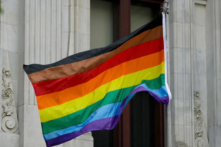 Philadelphia's altered gay pride flag is seen outside City Hall.