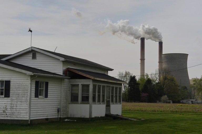 A home sits near the Gen. James Gavin Power Plant, a coal-fired power plant, on Monday, April 14, 2025, in Cheshire, Ohio. (AP Photo/Joshua A. Bickel)