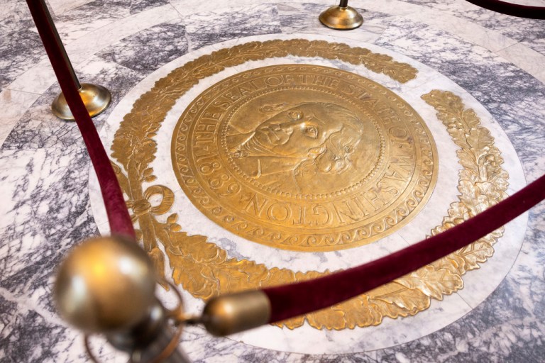 A bronze replica of the Washington State seal.