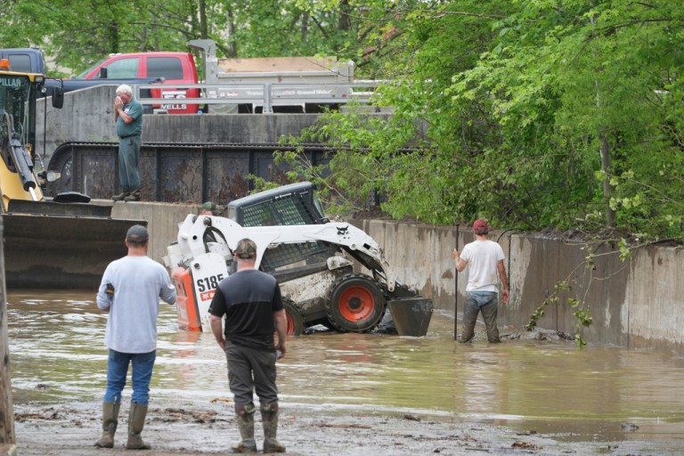 Work crews are trying to drain water as clean up continues after flooding on Wednesday, May 14, 2025 in Westernport, Md.