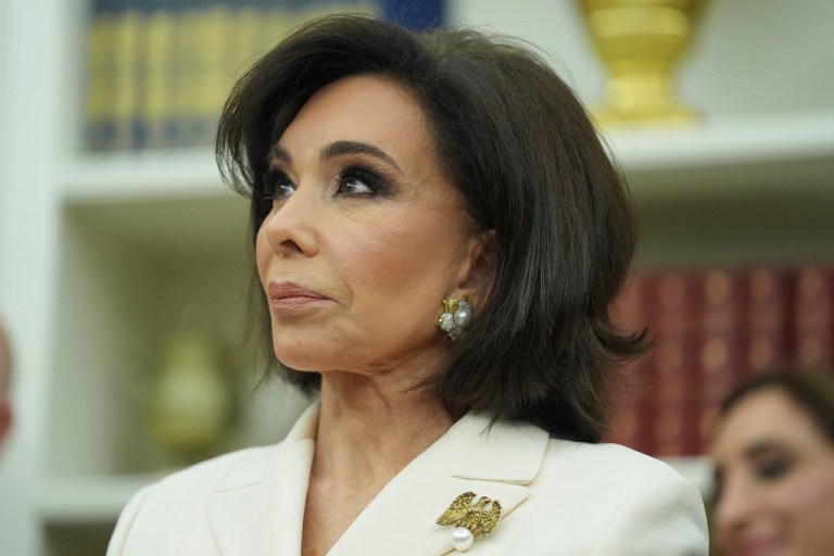 Jeanine Pirro in a white jacket.