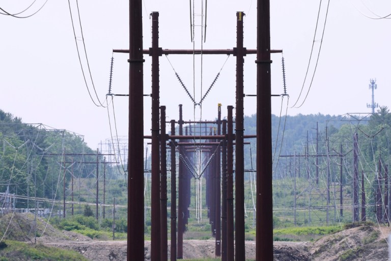 Electric transmission towers hold up power lines, Wednesday, June 4, 2025, in Pelham, N.H. (AP Photo/Charles Krupa)
