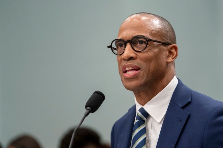 Secretary of Housing and Urban Development Scott Turner speaks into a microphone.