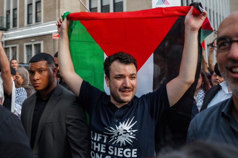 Pro-Palestinian activist Mahmoud Khalil carries a Palestinian flag during a rally celebrating his return from immigration detention, Sunday, June 22, 2025, in New York.