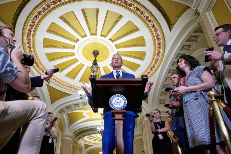 Sen. Majority Leader John Thune, R-S.D., center, talks after a policy luncheon on Wednesday, July 9, 2025, at the Capitol in Washington
