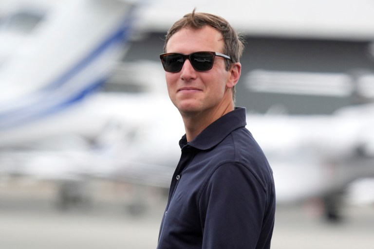 Jared Kushner stands outside.