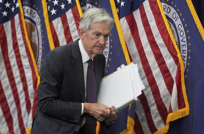 Federal Reserve Chairman Jerome Powell walks off after speaking during a news conference following the Federal Open Market Committee meeting,