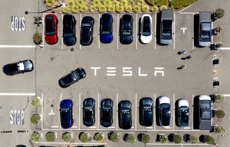 Tesla vehicles line a parking area at the company's Fremont, Calif., factory on Tuesday, Aug. 5, 2025.