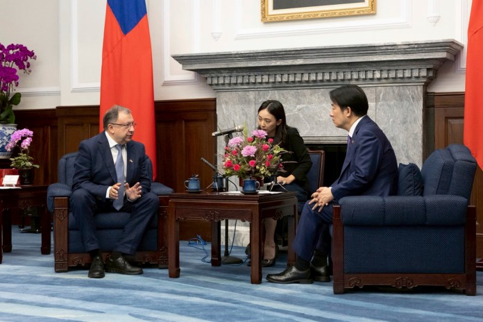 In this photo released by the Taiwan Presidential Office, Taiwanese President Lai Ching-te, right, talks to visiting Ukrainian parliamentarian Mykola Kniazhytskyi during a meeting, in Taipei, Taiwan on Thursday, Aug. 7, 2025.