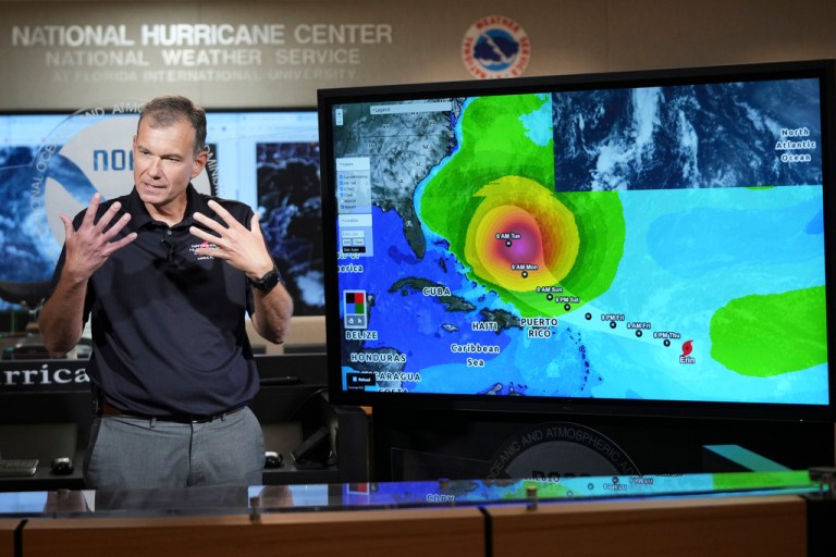 Jamie Rhome, deputy director of the National Hurricane Center, gives an update on Tropical Storm Erin at the National Hurricane Center, Thursday, Aug. 14, 2025, in Miami.