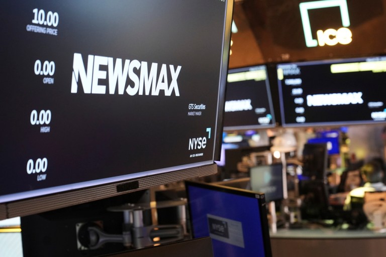 A display shows a Newsmax logo on the day of their IPO on the floor at the New York Stock Exchange in New York, March 31, 2025. (AP Photo/Seth Wenig, File)