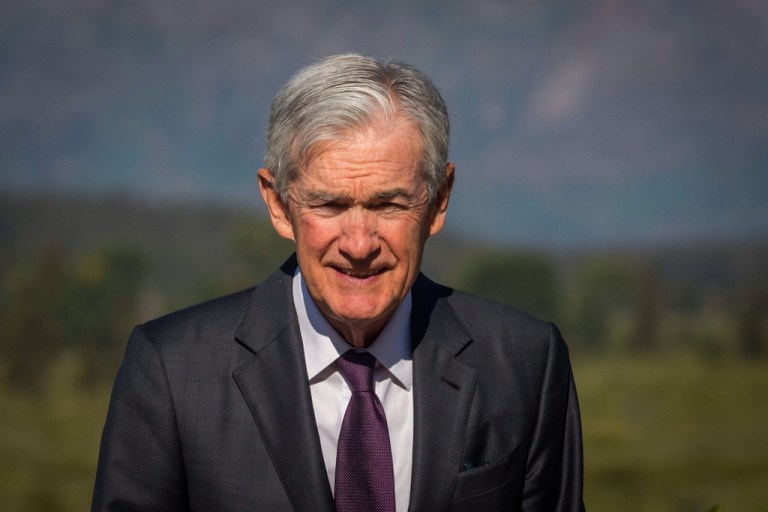 Federal Reserve Chairman Jerome Powell walks outside.
