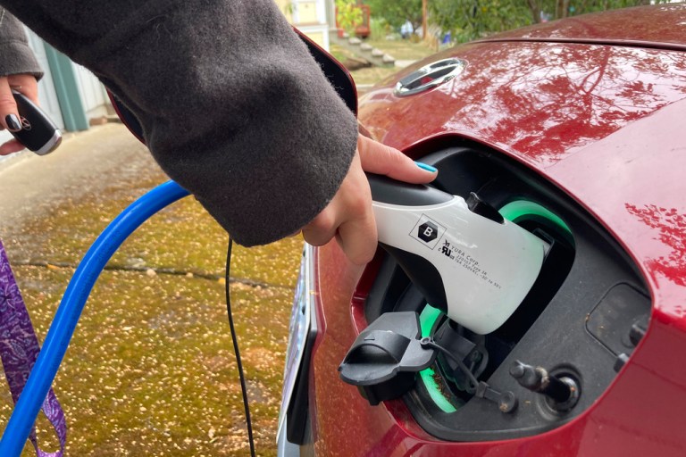 A person charging their electric vehicle