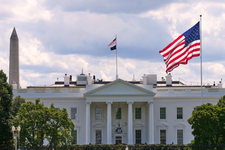 The White House is seen with American flags flying, Tuesday, Aug. 26, 2025, in Washington.