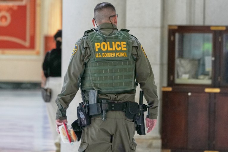 A member of the U.S. Customs and Border Protection Police patrols Union Station.
