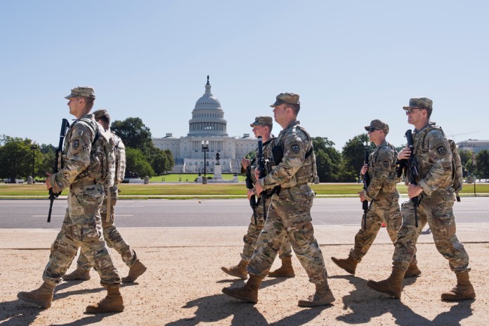 FILE—A week before Congress returns from recess, armed National Guard soldiers from West Virginia patrol the Mall near the Capitol in Washington, as part of President Donald Trump's order to impose federal law enforcement in the nation's capital, Tuesday, Aug. 26, 2025. Congress is scheduled to return from their August break Tuesday, Sept. 2, 2025, after Labor Day.