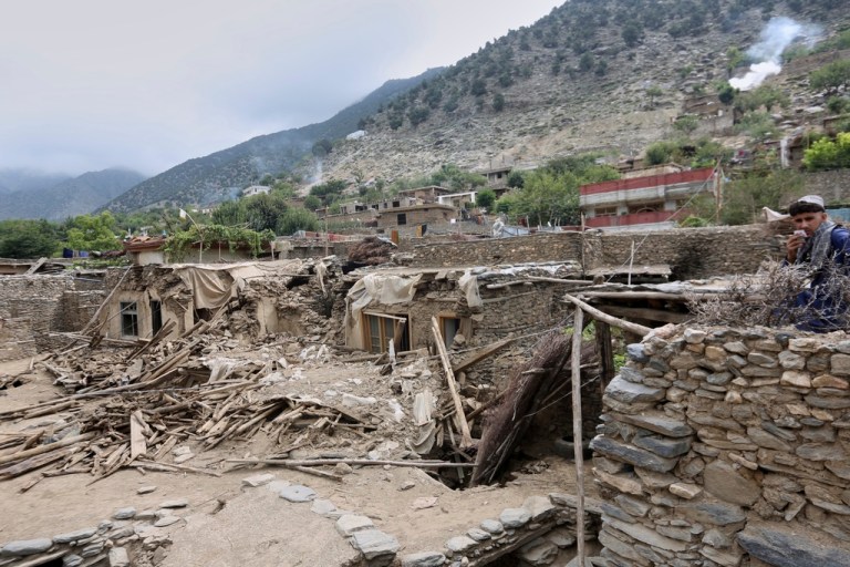 Collapsed houses are seen in an area devastated by Sunday's powerful 6.0-magnitude earthquake.