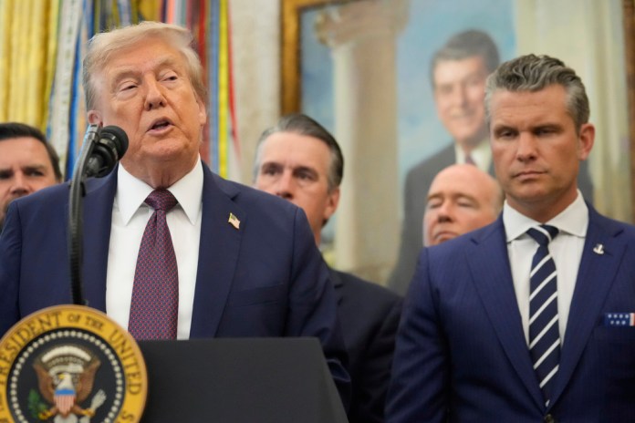 President Donald Trump speaks about the relocation of U.S. Space Command headquarters from Colorado to Alabama in the Oval Office of the White House, Tuesday, Sept. 2, 2025, in Washington, as Defense Secretary Pete Hegseth listens at right. 