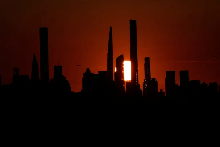 The New York City skyline is seen as the sun sets before a quarterfinal round of the U.S. Open tennis championships, Tuesday, Sept. 2, 2025, in New York.