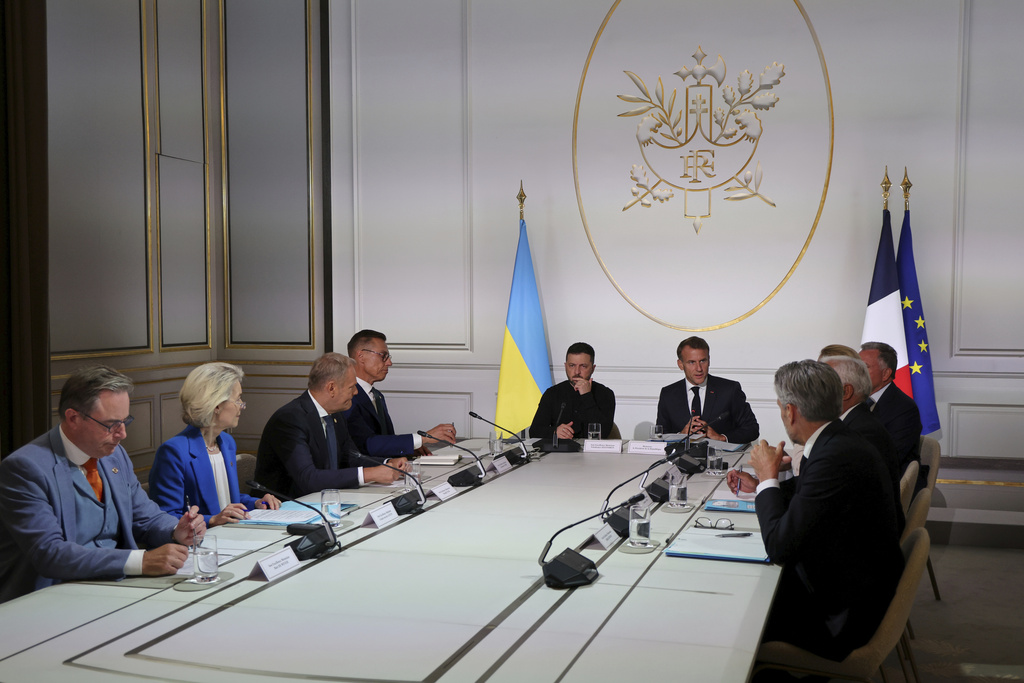 From left, Belgium's Prime Minister Bart De Wever, European Commission President Ursula von der Leyen, Poland's Prime Minister Donald Tusk, Finland's President Alexander Stubb, Ukraine's President Volodymyr Zelenskyy and French President Emmanuel Macron speak during a summit on Ukraine at the Elysee Palace, in Paris, France, Thursday, Sept. 4, 2025. (Ludovic Marin/Pool Photo via AP)