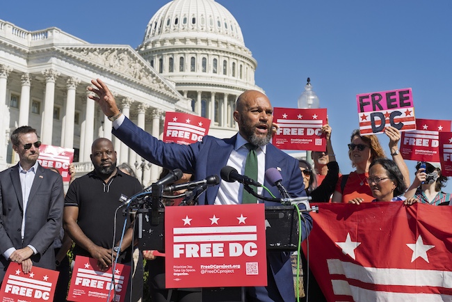 DC Councilmember Robert White, center, joins elected officials in a call to end the presence of National Guard​ troops in the District of Columbia at the Capitol in Washington, Thursday, Sept. 4, 2025.