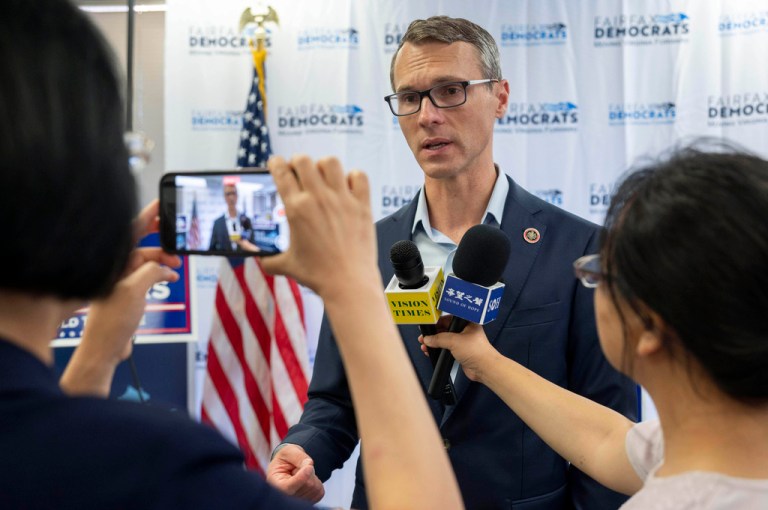 Democratic candidate James Walkinshaw, who is running for the empty 11th congressional seat in Virginia, talks with reporters following a news conference, Friday, Sept. 5, 2025 in Fairfax, Va. Walkinshaw will face Republican Stewart Whitson in a special election on Sept. 9 to fill Rep. Gerry Connolly's congressional seat in Fairfax County (AP Photo/Kevin Wolf)