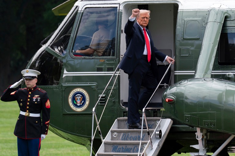 President Donald Trump makes a fist as he boards Marine One on the South Lawn of White House in Washington, Sunday, Sept. 7, 2025.