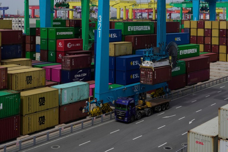 A crane operating at a port of shipping containers in China.