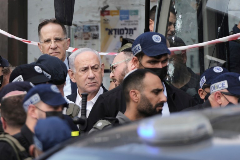 Benjamin Netanyahu visiting scene of shooting at bus stop in Jerusalem.