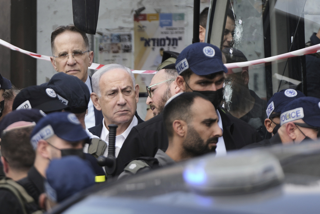 Israeli Prime Minister Benjamin Netanyahu surrounded by Israeli police officers.