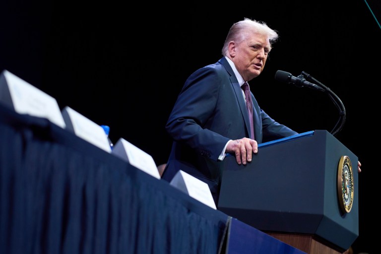 President Donald Trump at a podium.