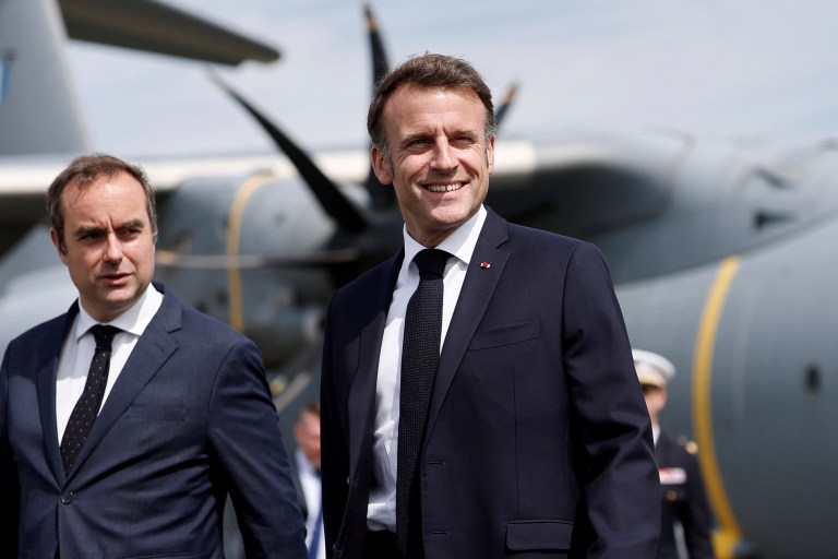 FILE - French Defense Minister Sebastien Lecornu, left, receives President Emmanuel Macron at the 55th International Paris Airshow at Le Bourget Airport near Paris, June 20, 2025.