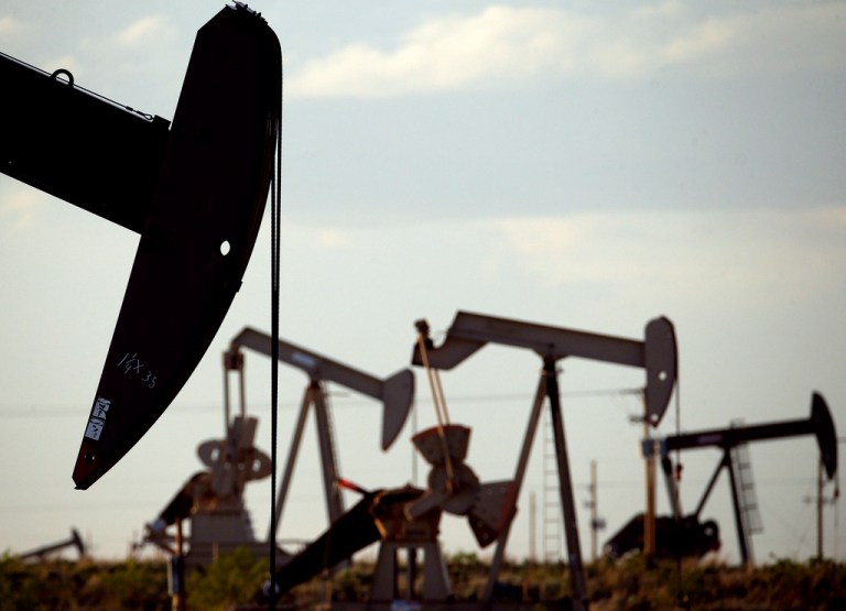 FILE - Pumpjacks work in a field near Lovington, N.M., on April 24, 2015. (AP Photo/Charlie Riedel, File)