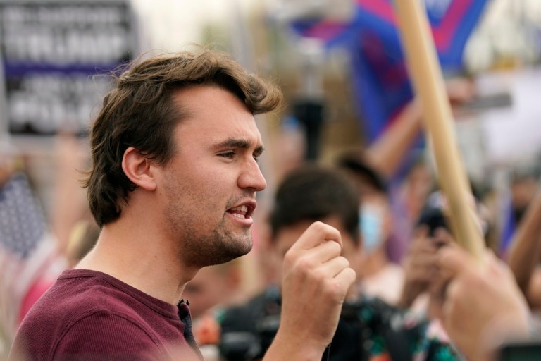 Charlie Kirk, conservative activist and founder of Turning Point USA, speaks to supporters of President Donald Trump at a rally outside the Maricopa County Recorder's Office, Friday, Nov. 6, 2020, in Phoenix.