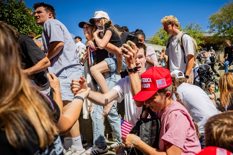 The crowd reacts after Charlie Kirk, the CEO and co-founder of the conservative youth organization Turning Point USA, is shot at the Utah Valley University Wednesday, Sept. 10, 2025, in Orem, Utah. (Tess Crowley/The Deseret News via AP)