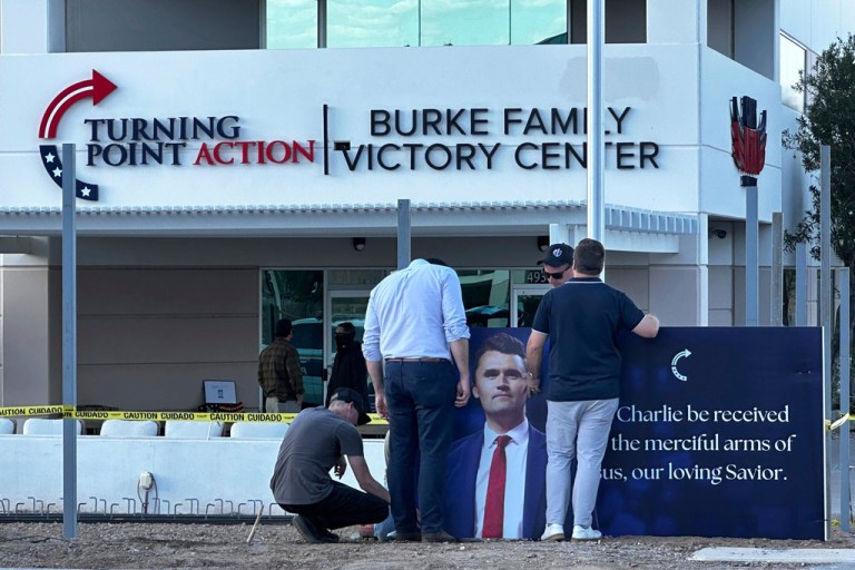 A large banner that reads “May Charlie be received into the merciful arms of Jesus, our loving Savior,” is installed outside the Turning Point USA headquarters in Phoenix, Wednesday, Sept. 10, 2025.