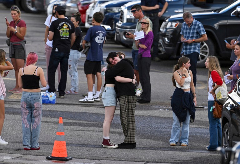 Students reunite with loved ones and classmates outside Bergen Meadow Elementary School after a shooting at nearby Evergreen High School on Wednesday, Sept. 10, 2025, in Evergreen, Colorado