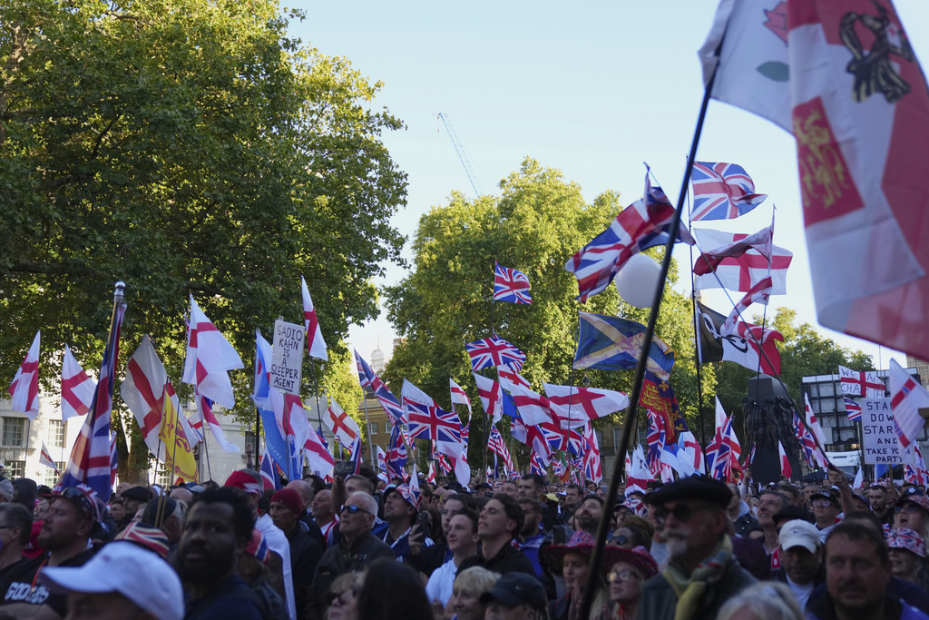 People demonstrate during the Tommy Robinson-led Unite the Kingdom march and rally.