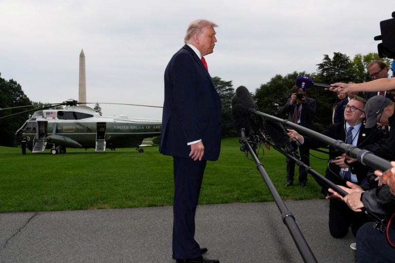 President Donald Trump speaks with reporters.