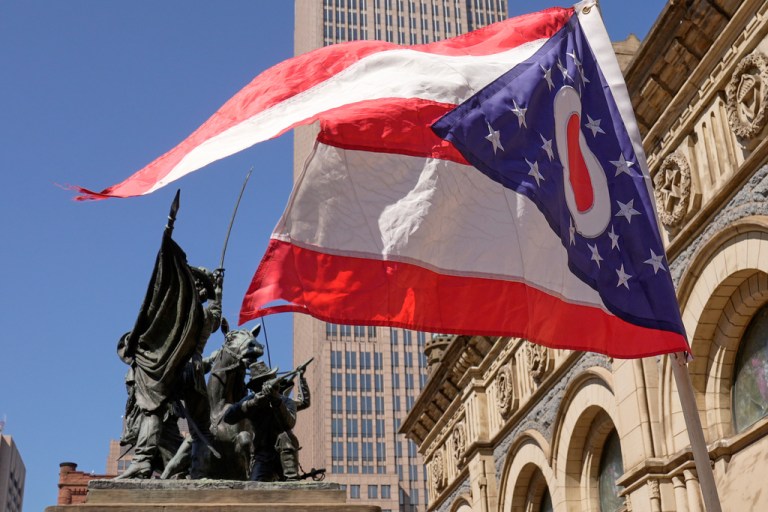 A state of Ohio flag flies in front of the Soldiers' and Sailors' monument in Cleveland.