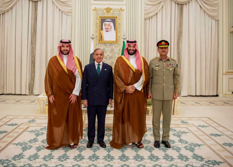 In this photo released by Pakistan's Press Information Department, Saudi Arabia's Crown Prince Mohammed bin Salman, second right, Saudi Arabia's Defence Minister Khalid bin Salman, left, Pakistan's Prime Minister Shehbaz Sharif, second left, and Pakistan's Army Chief Field Marshal Asim Munir, pose for photographs after signing a mutual defense pact, in Riyadh, Saudi Arabia, Wednesday, Sept. 17, 2025.