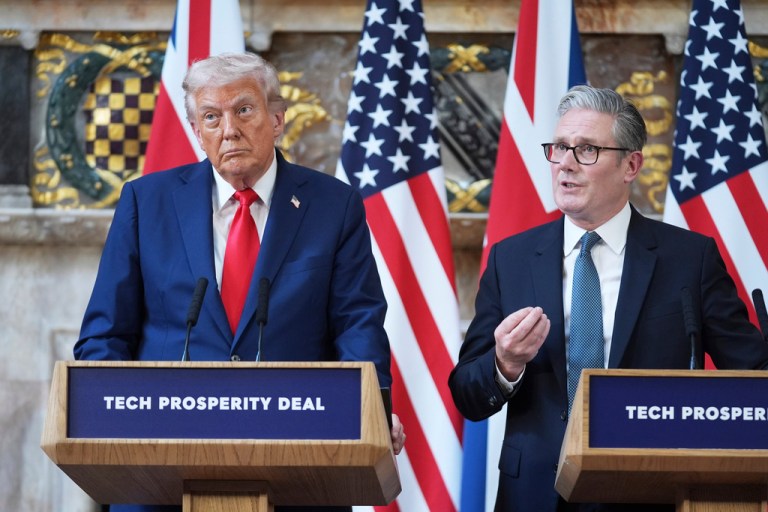 President Donald Trump listens as U.K. Prime Minister Keir Starmer answers questions.