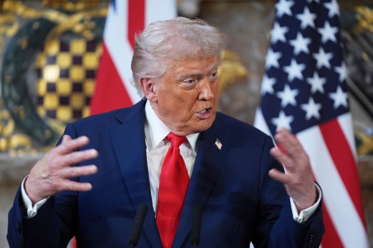 President Donald Trump gestures during a joint press conference.