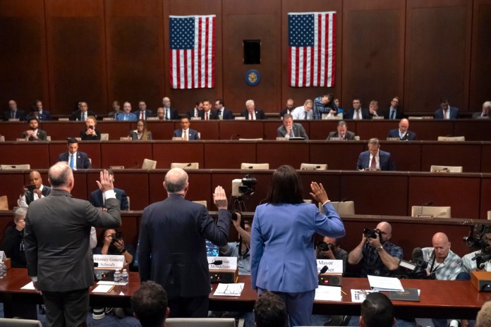 District of Columbia Attorney General Brian Schwalb, from left, D.C. Council Chairman Phil Mendelson, and D.C. Mayor Muriel Bowser are sworn in during a hearing of the House Committee on Oversight and Government Reform on Capitol Hill, Thursday, Sept. 18, 2025, in Washington. (AP Photo/Mark Schiefelbein)