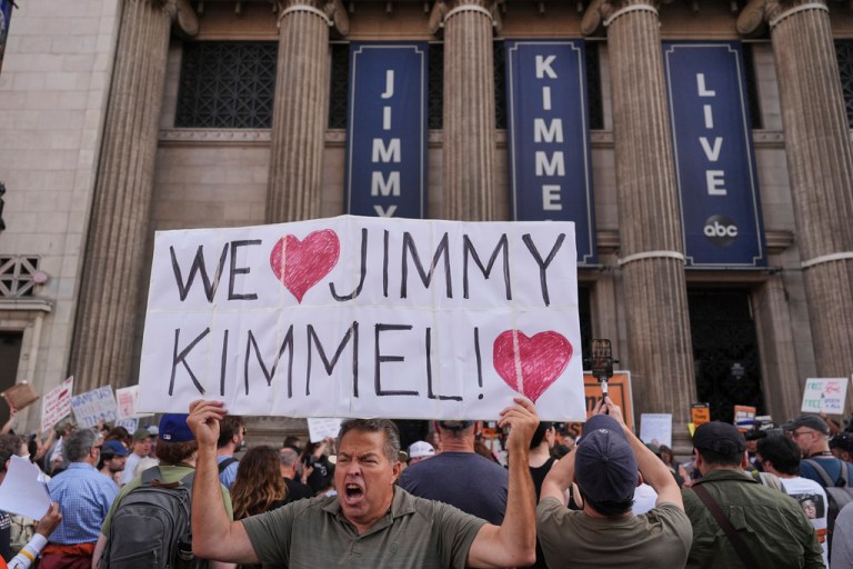 Oscar Villanueva holds a sign outside El Capitan Entertainment Centre, where the late-night show 
